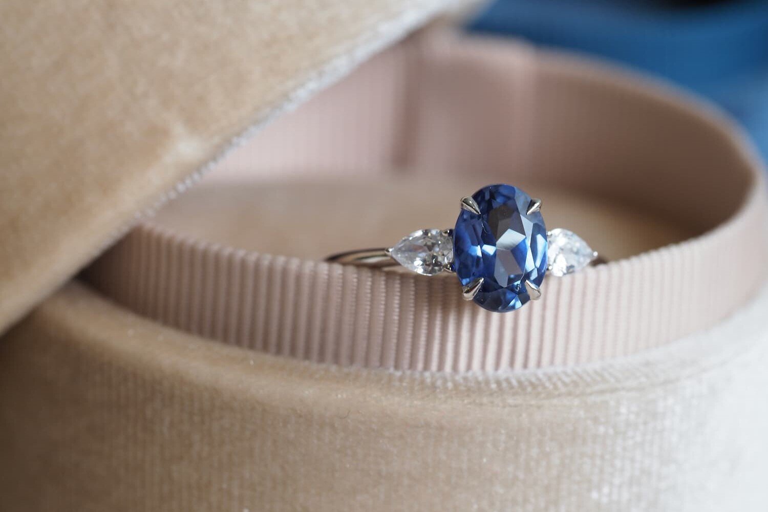 Oval blue sapphire ring kept in velvet bix