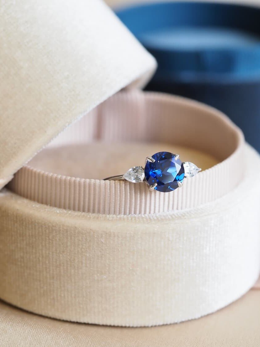 Blue sapphire ring kept in velvet box - fire shine