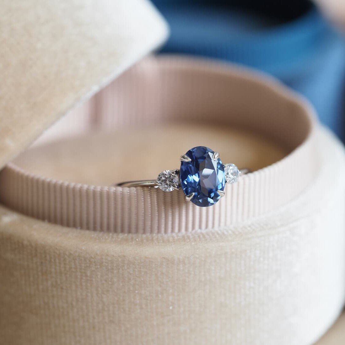 Oval blue sapphire ring kept in velvet box