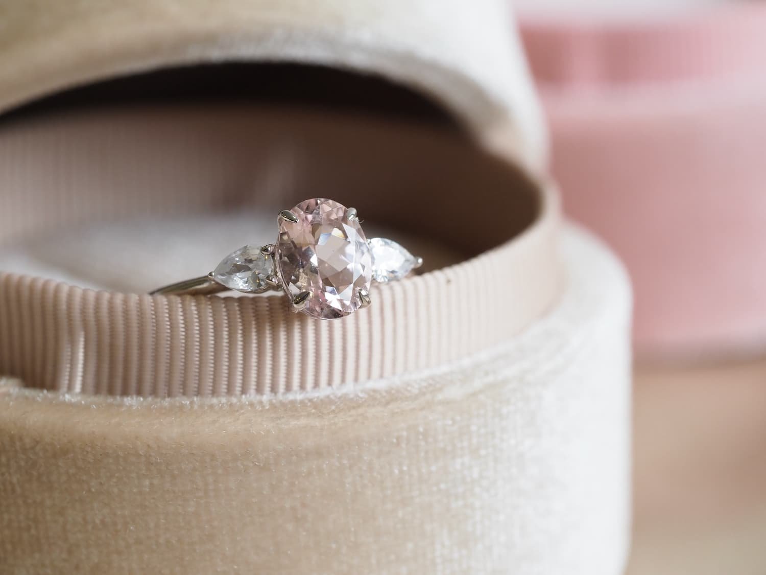 Lisa Morganite engagement rings with pear diamonds in velvet box