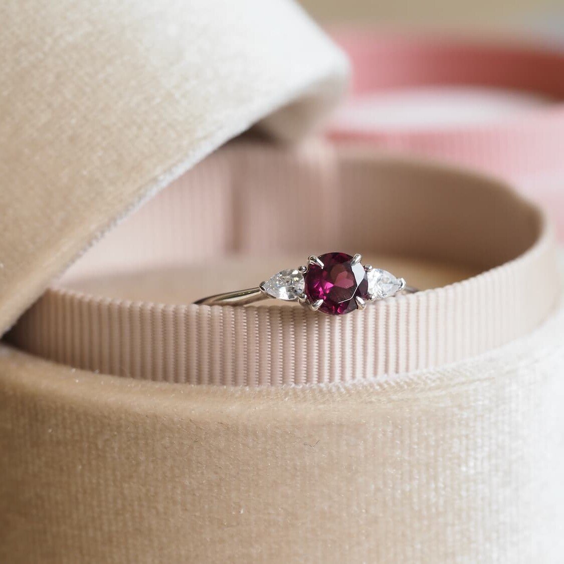 Rhodolite engagement ring with pear diamonds
